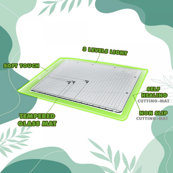 Crafting tools on the clear Tempered Glass Board Cutting Mat, showing grid lines through.