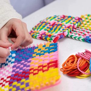 Beginner's weaving project in progress with materials from the Weaving Loom Retro Craft Kit