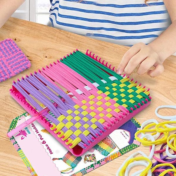Hands weaving on the durable loom from the Retro Craft Kit, showcasing colorful yarn