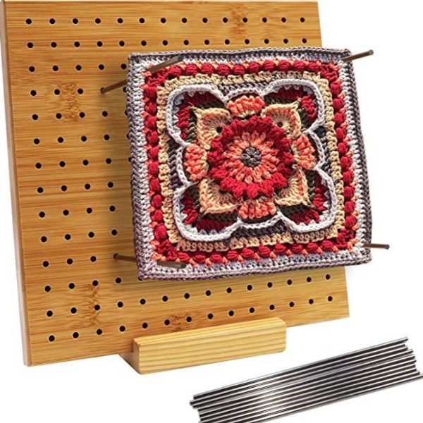 Crafting enthusiast using Handcrafted Wooden Blocking Board to perfect knit pieces.