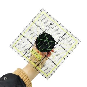 User-friendly Ruler Handle Suction Cup attached to a quilting ruler